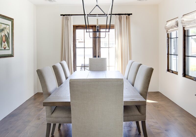 AFTER - This formal Dining Room is a great space for entretaining both in and outside. The elegant hardwood flooring  keeps this home warm and  the French doors open to the front patio with amazing views of Camelback Mountain. 